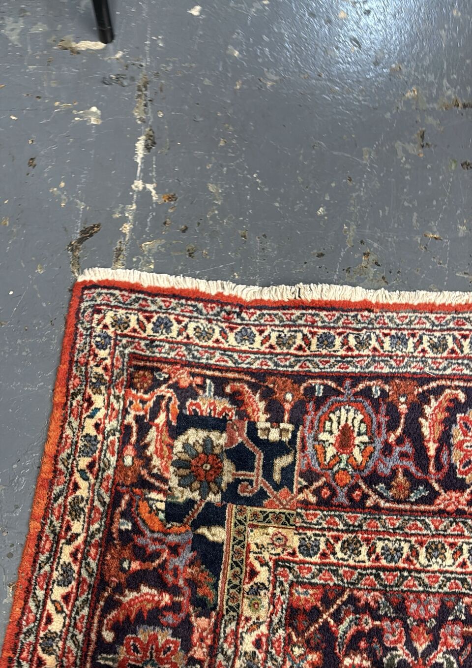 After re-weaving: the same Persian rug with the hole rebuilt knot by knot and the pattern restored