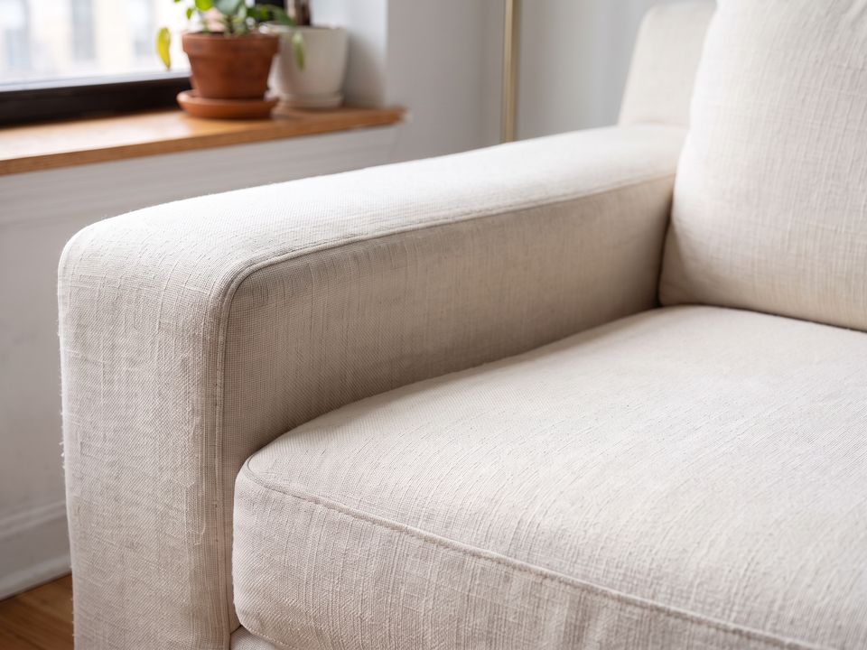 Illustration: the same sofa arm after a professional clean